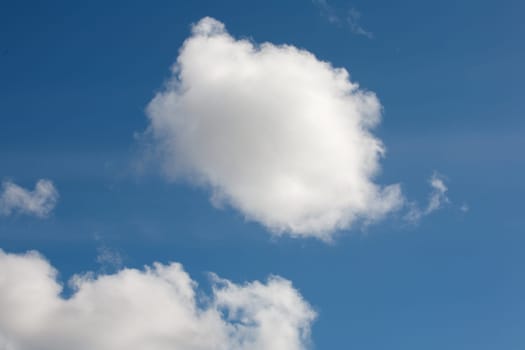 Some white clouds against the blue sky