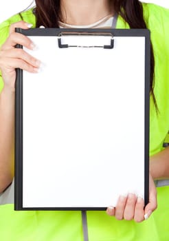 Female worker with reflector vest showing a blank paper