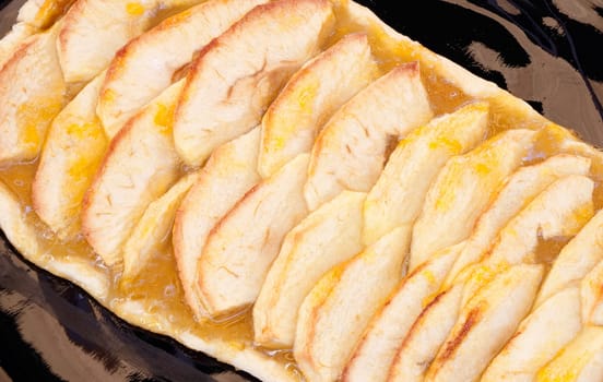 Delicious apple pie on a black plate