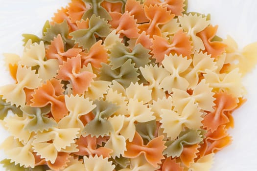 Many ties of colored pasta. Delicious carbohydrate