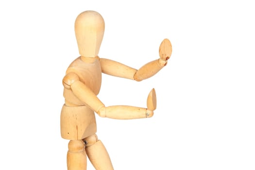 Jointed wooden mannequin pushing something isolated on white background