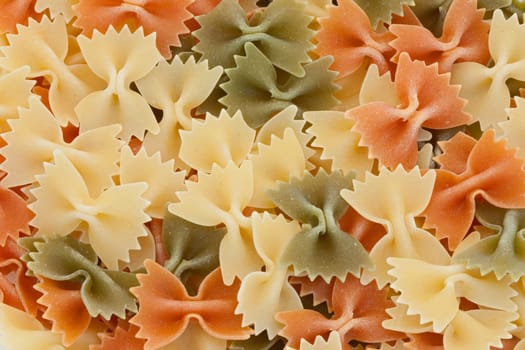 Many ties of colored pasta. Delicious carbohydrate