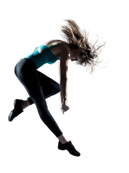 Side view of an energetic female doing aerobics isolated on white background