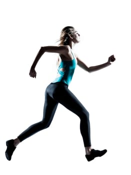 Side view of a young sporty woman jogging isolated on white background