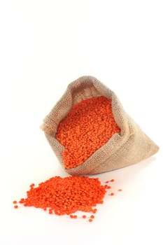 dried red lentils in a jute bag
