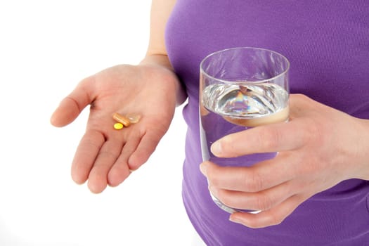 Young woman taking pills