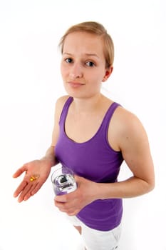 Young woman taking pills