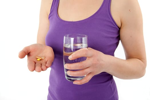 Young woman taking pills
