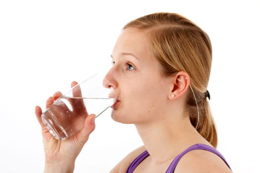 Young woman drinking water from a glass