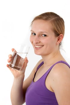 Young woman drinking water from a glass