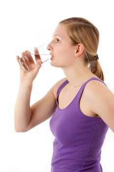 Young woman drinking water from a glass