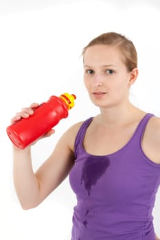 Young woman drinking from a drinking bottle