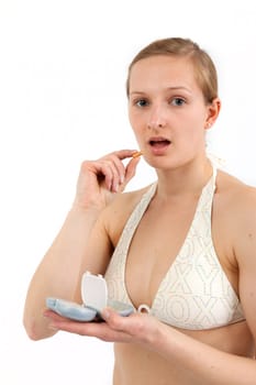 Young woman with pill box before taking