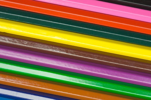 row of wooden pencils of many colors