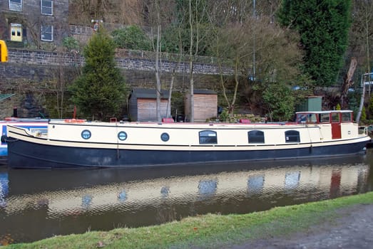 An old narrowboat on the Rochdale Canal at Hebden Bridge