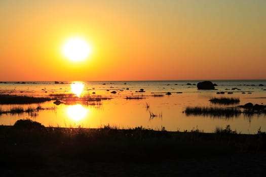 Wiew on evening sea with randomly placed rocks