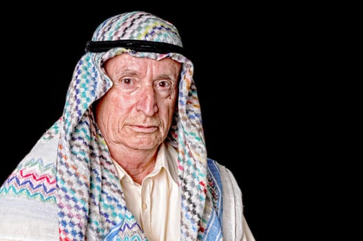 Portrait of an elder arab isolated on black