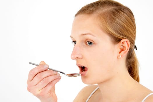 Woman taking medical drops