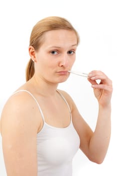 Young woman measuring fever