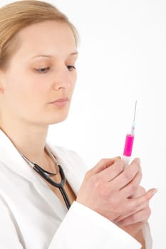 Young female doctor or nurse giving injection