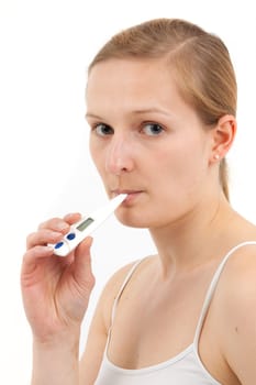 Young woman measuring fever