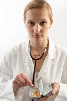Female doctor or nurse with tablets