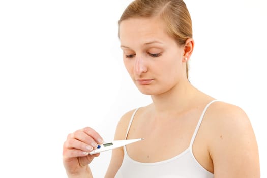 Young woman measuring fever