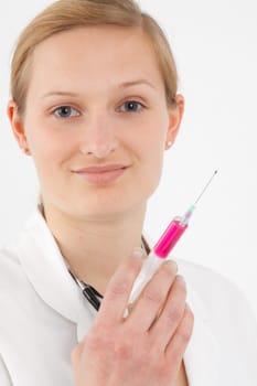 Young female doctor or nurse giving injection