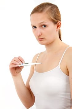 Young woman measuring fever