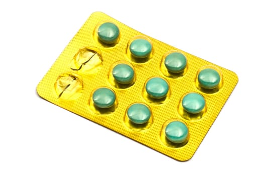 Package of Green Pills Closeup on white