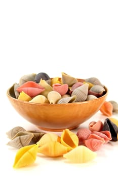 Colorful raw noodles against white background