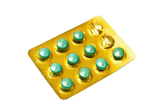 Package of green pills isolated on white background