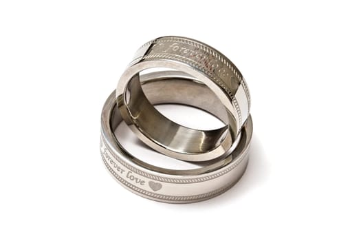 Wedding rings of Forever Love isolated on white background