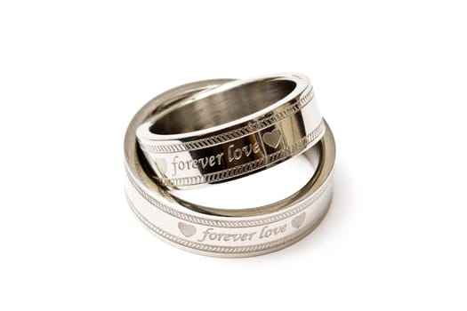 Wedding rings of Forever Love isolated on white background