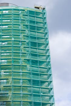 Modern Building Under Construction With Scaffolding