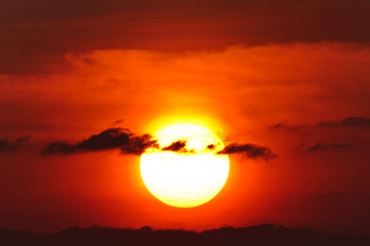 a beautiful sunrise through the clouds black