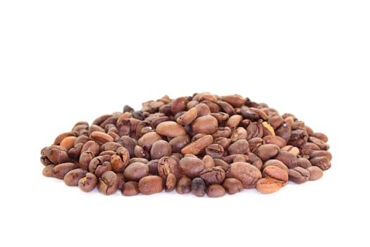 a handful of coffee beans against a white background