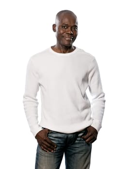 Portrait of a happy casual afro American man standing with hands in pocket in studio on white isolated background