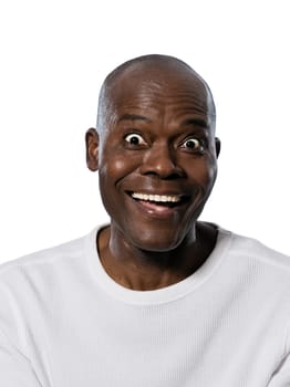 Portrait of an expressive Afro American man smiling with eyes wide open in studio on white isolated background