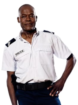 Portrait of an afro American policeman with hand on waist in studio on white isolated background