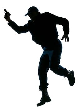 Full length of an afro American police officer running with a handgun on white isolated background