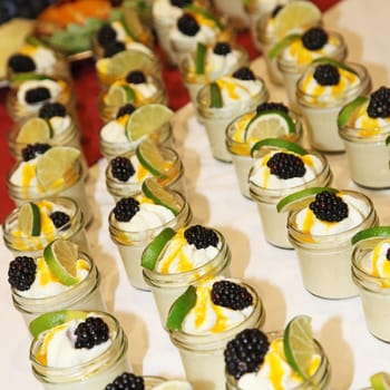 Pudding decorated with fruit - in a row - square