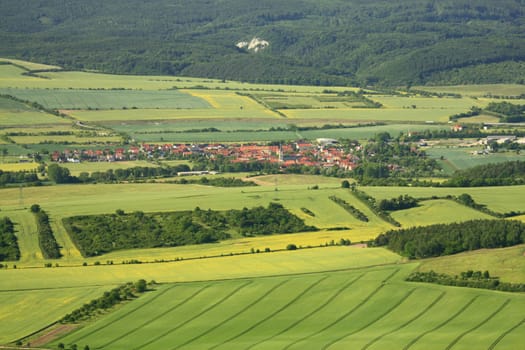 Aerial view of partly flowering arable land and rapeseed fields