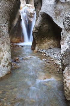 beautiful waterfall among large stones, Sugaului Gorge, Bicaz, Romania