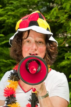 Female football fan with hat and Germany flag