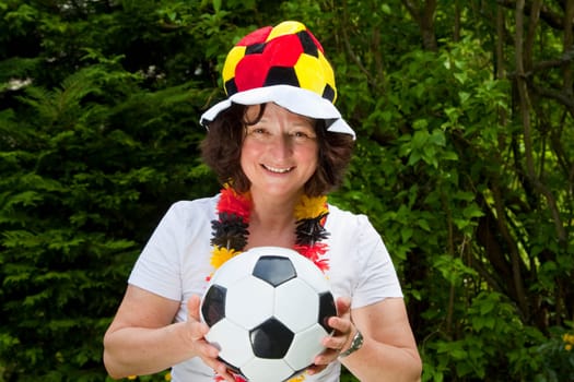 Female football fan with hat and Germany flag