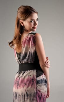 beautiful young fashion model woman on grey background