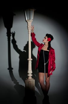 beautiful young glamorous woman  with lightpole