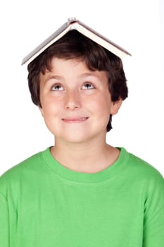 Student child with a book on his head isolated over white background