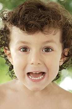 photo of an adorable happy boy making trivialities